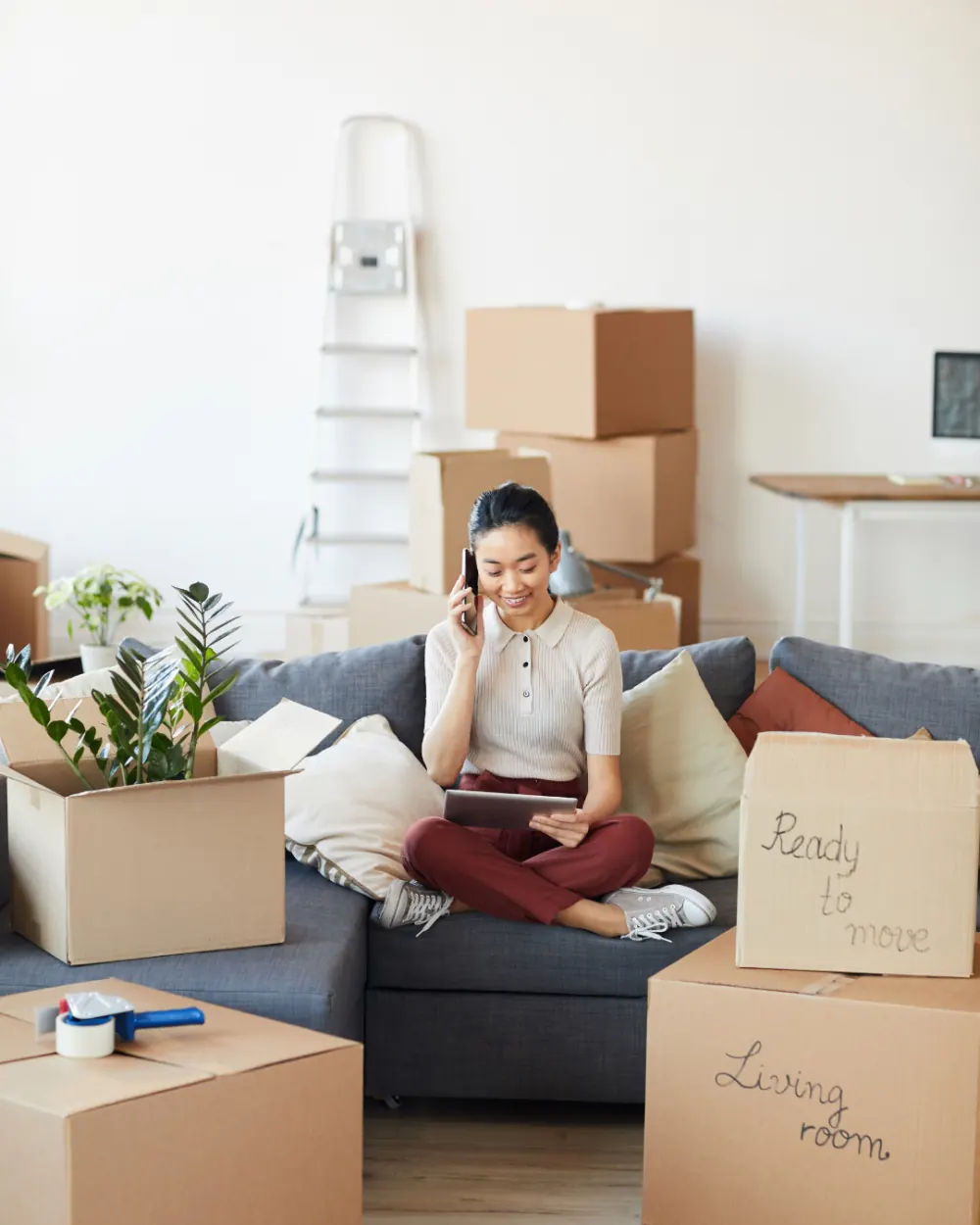 Move-in ready living room with packed boxes labeled ready to move